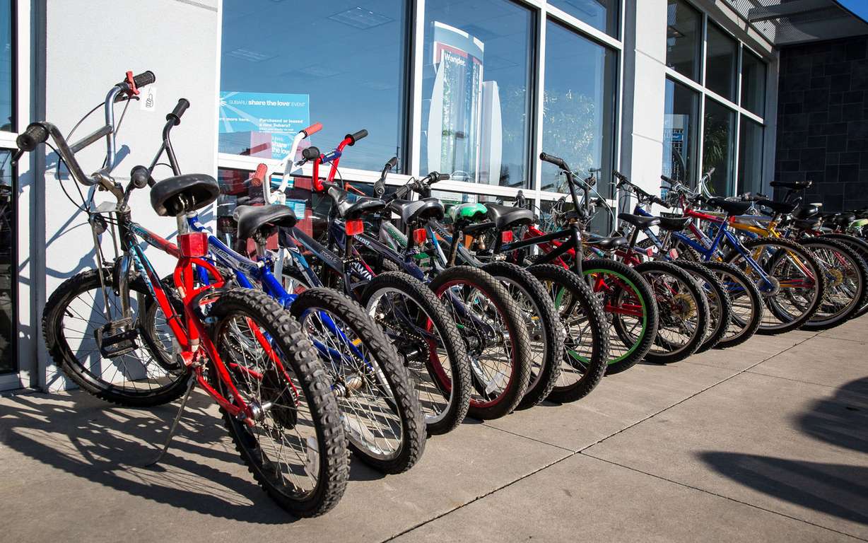 About 200 boys and girls from lower-income families received free refurbished bikes from Free Bikes 4 Kidz as early Christmas gifts at Nate Wade Subaru in Salt Lake City on Saturday, Dec. 15, 2018. (Photo: Qiling Wang, KSL)