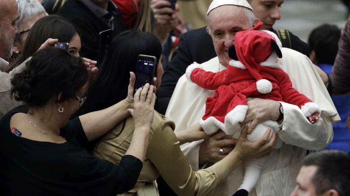 Kids at a Vatican charity give Pope Francis a birthday cake