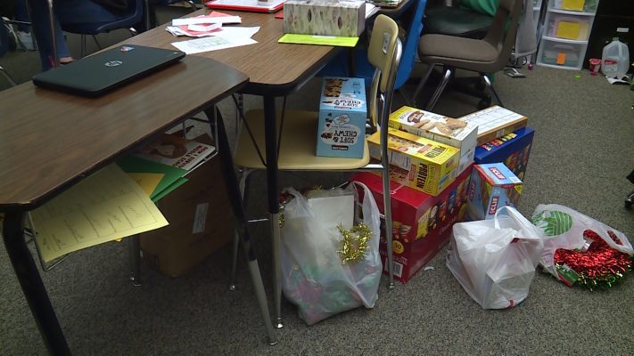Food sits on the floor of Krista Gibbons' classroom, before being moved into her food pantry Tuesday, Dec.11, 2018. Photo: Ray Boone, KSL TV