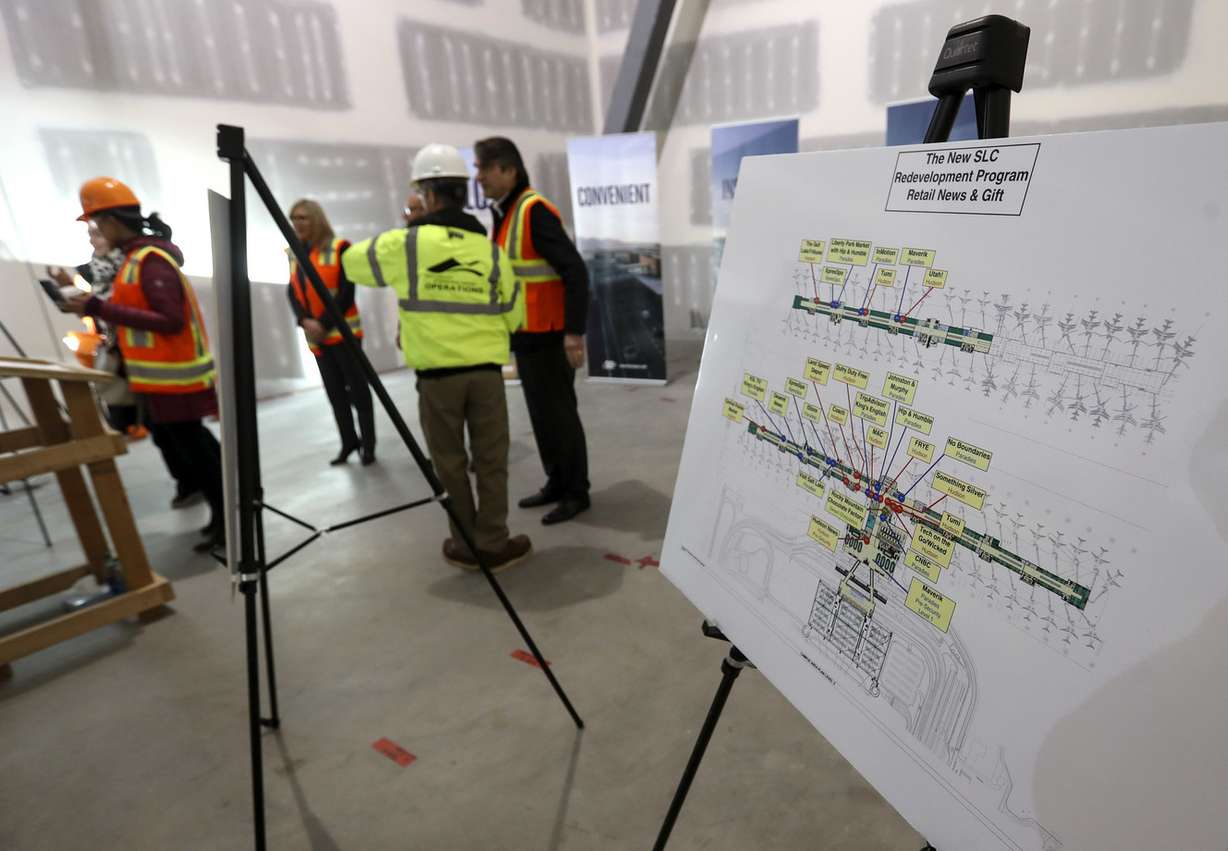 John Buckner, director of administration and commercial services at the Salt Lake City Department of Airports, center, stands in a new retail space as he speaks during a press conference in the new airport under construction in Salt Lake City on Tuesday, Dec. 18, 2018. (Photo: Steve Griffin, KSL)