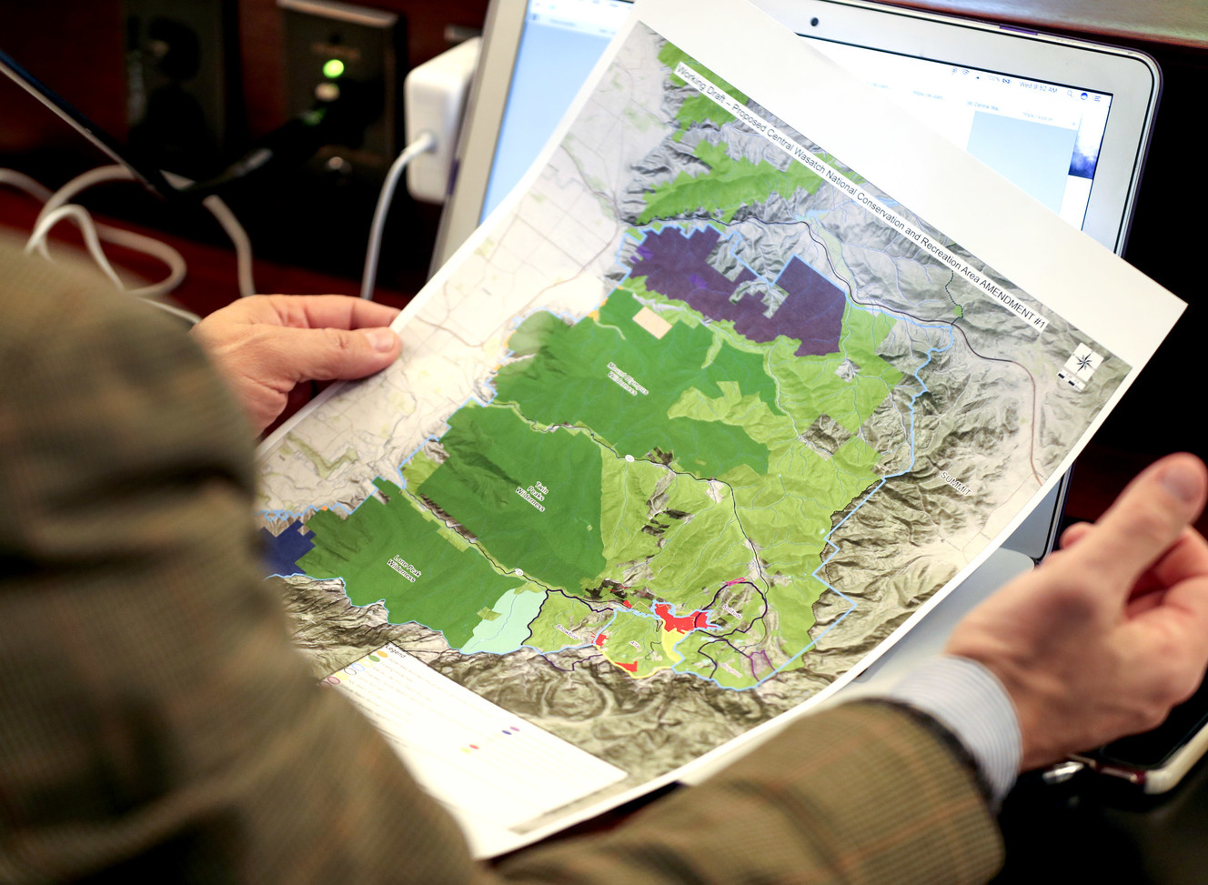 Rep. Joel Briscoe, D-Salt Lake City, holds a map of the proposed federal designation legislation creating a Central Wasatch Conservation and Recreation Area during the Commission for the Stewardship of Public Lands meeting at the Utah State Capitol in Salt Lake City on Wednesday, Dec. 19, 2018. (Photo: Steve Griffin, KSL)