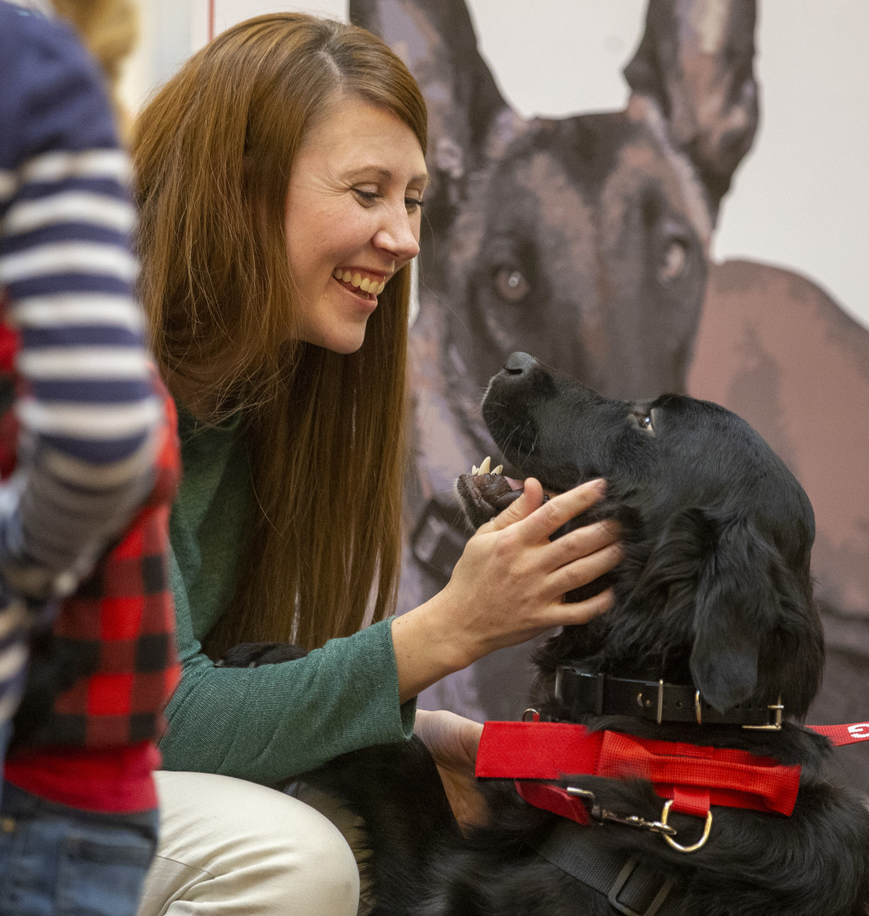 Keri Seelye talks to Nick the service dog as her husband, Army veteran Daniel Seelye, is officially given a service dog at Fashion Place Mall in Murray on Wednesday, Dec. 19, 2018. (Photo: Scott G Winterton, KSL)