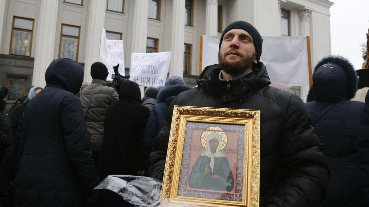 Orthodox believers rally to protest Ukraine parliament vote