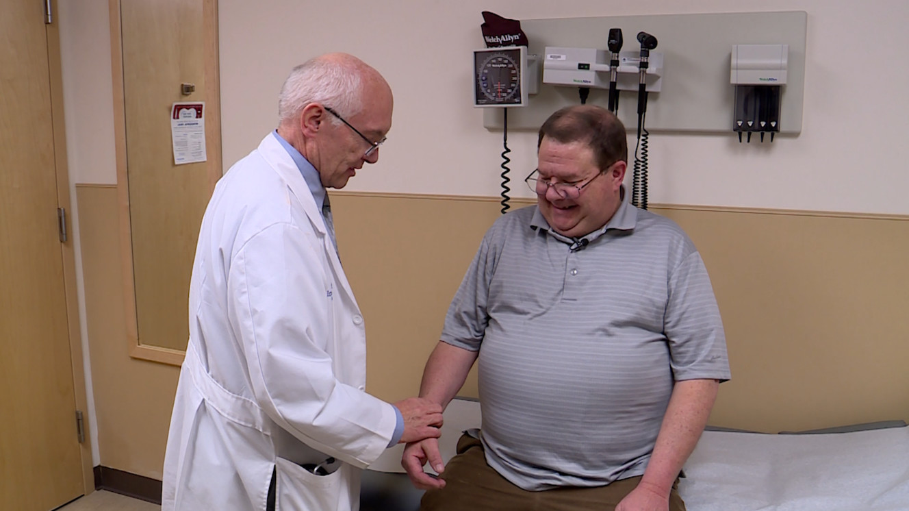 Dr. Brent Muhlestein checks up on his patient Morey Day. (Photo: KSL TV)