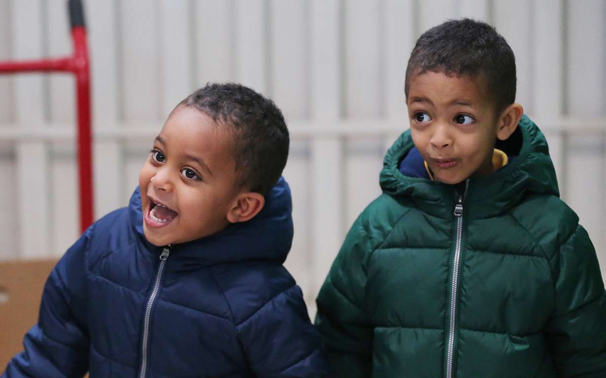 Unidentified children smile as they pick up gifts during the Salvation Army’s Angel Tree program in Salt Lake City on Friday, Dec. 21, 2018. Through the ongoing partnership between the Salt Lake Education Foundation and The Salvation Army, 1,469 school students, under the age of 13, received gifts and clothing. (Photo: Jeffrey D. Allred, KSL)