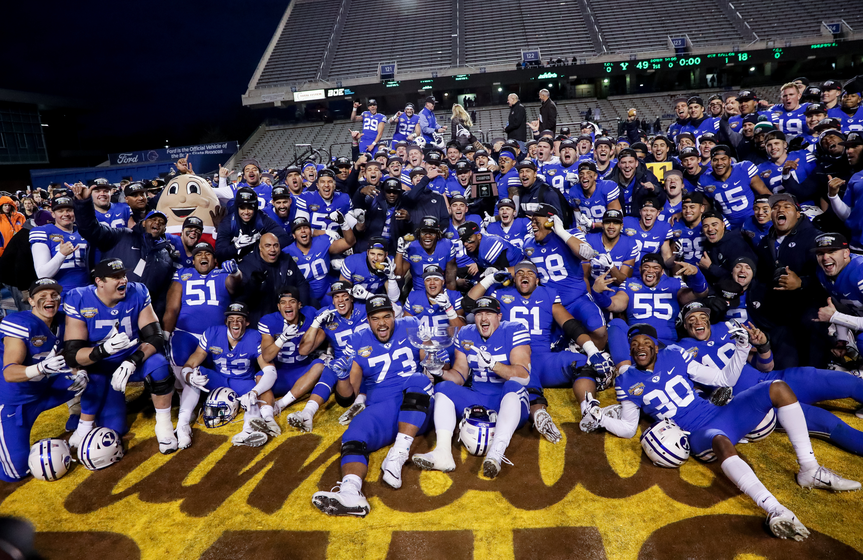 Brigham Young Cougars players pose for a photo after their win over the Western Michigan Broncos in the Famous Idaho Potato Bowl at Albertsons Stadium in Boise, Idaho on Friday, Dec. 21, 2018. (Photo: Spenser Heaps, Deseret News)