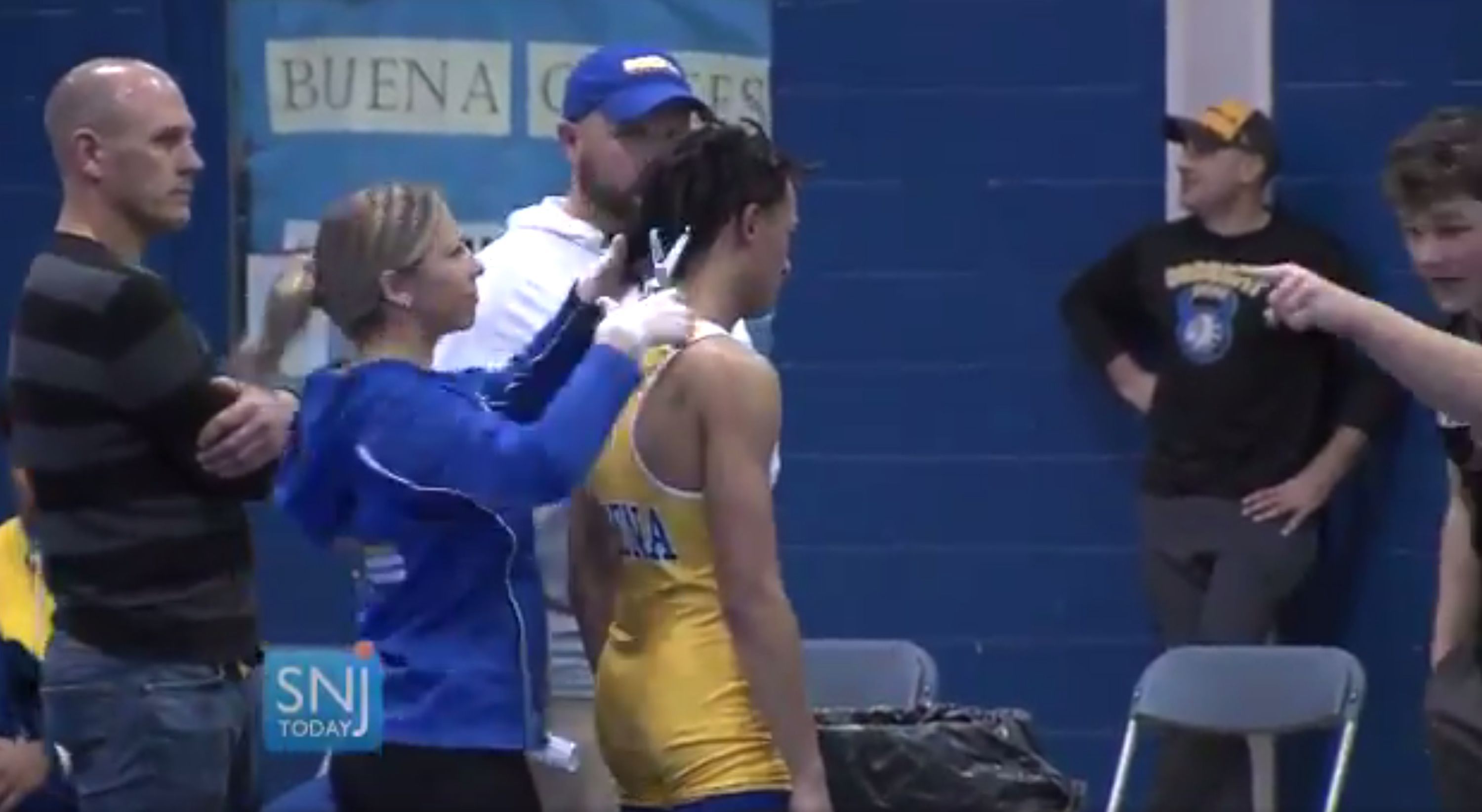 Athletic group benching ref who told wrestler to cut dreads