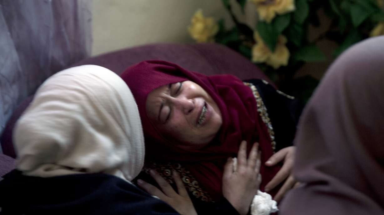 The Latest: Hamas says dissolving parliament invites chaos