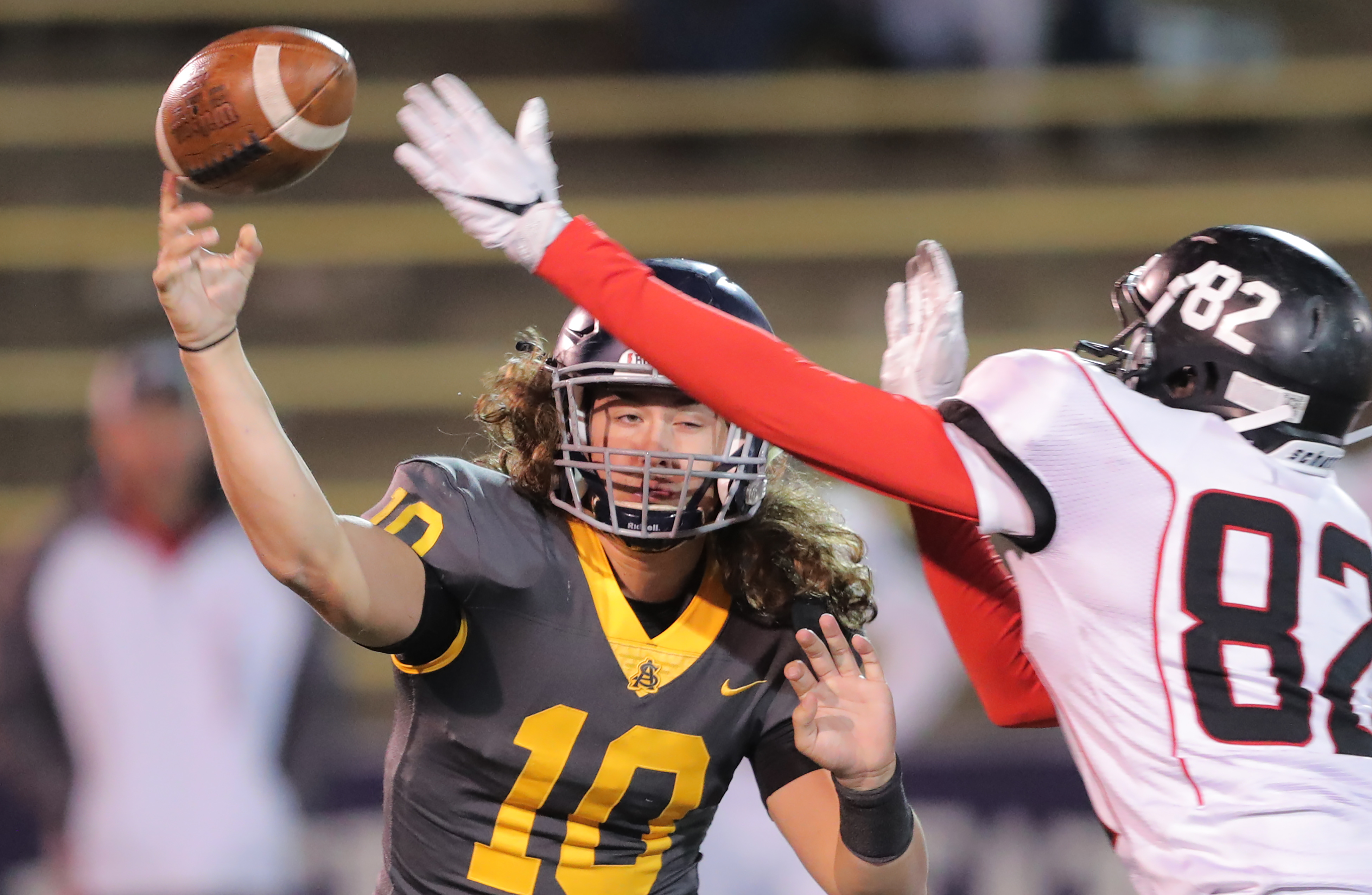 Summit Academy quarterback Kasey Briggs passes over North Sanpete's Kout Mayoul during play in the 3A state football championship at Weber State's Stewart Stadium in Ogden on Saturday, Nov. 10, 2018. (Photo: Scott G Winterton, KSL)