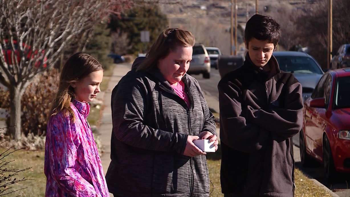 Robyn Buatte (center) talks to KSL TV about how her North Ogden community is helping her family through the experience of losing a home right before Christmas following a house fire that destroyed the home. (Photo: John Perry, KSL TV)