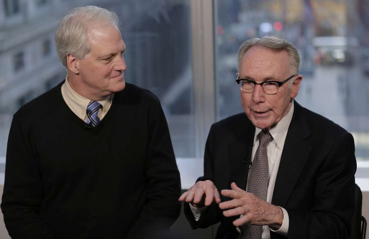 In this Dec. 19, 2018 photo, Craig Antico, left, and Jerry Ashton, co-founders of RIP Medical Debt, talks to reporters in New York. The co-founders of RIP Medical Debt buy millions of dollars in past-due medical debt for pennies on the dollar. But instead of hounding people to pay, they send letters saying the debt is erased, no strings attached. (AP Photo/Seth Wenig)