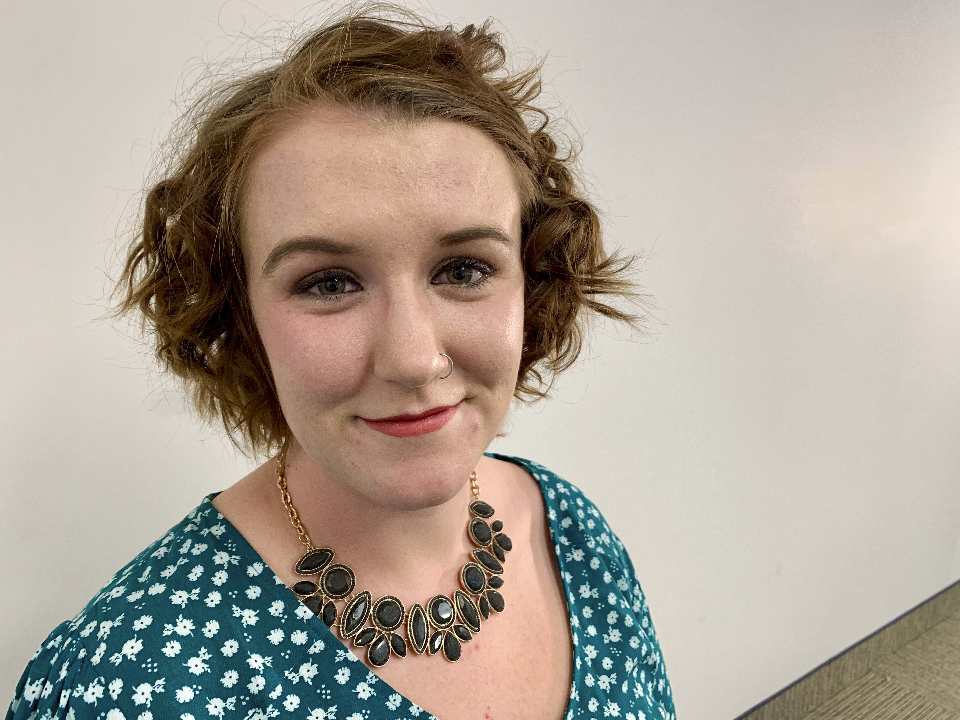 In this Dec. 18, 2018 photo, Sam Gaspardo poses for a portrait at the Associated Press bureau in Minneapolis. She said police in Woodbury, Minn., lacked a sense of urgency when she first reported that she had been sexually assaulted in 2011 and that she was given the runaround and placed on hold indefinitely when trying to follow up on her case. (AP Photo/Jeff Baenen)