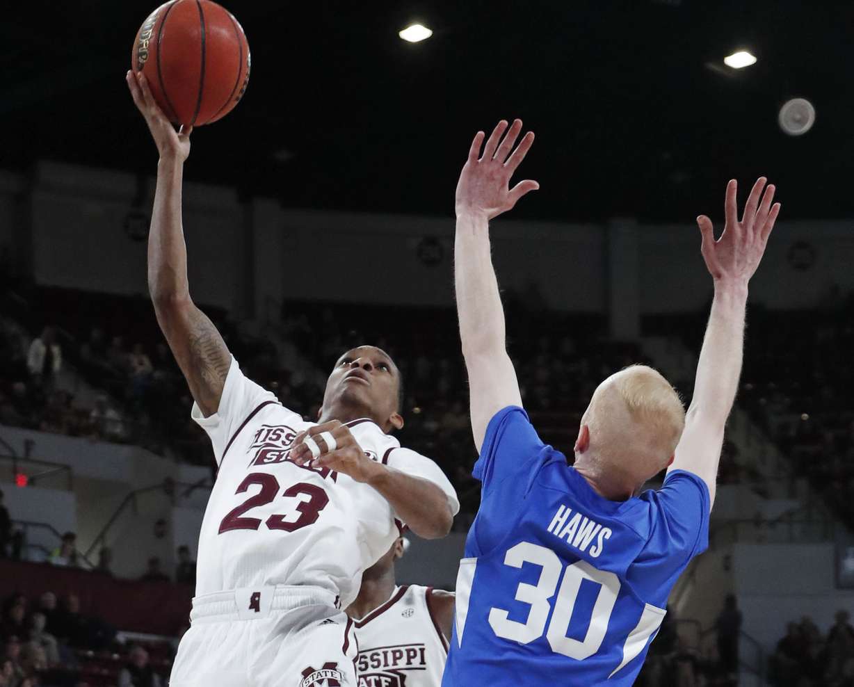 Mississippi State guard Tyson Carter (23) shoots over the defense of Brigham Young guard TJ Haws (30) in the first half of an NCAA college basketball game in Starkville, Miss., Saturday, Dec. 29, 2018. (Photo: Rogelio V. Solis, AP)