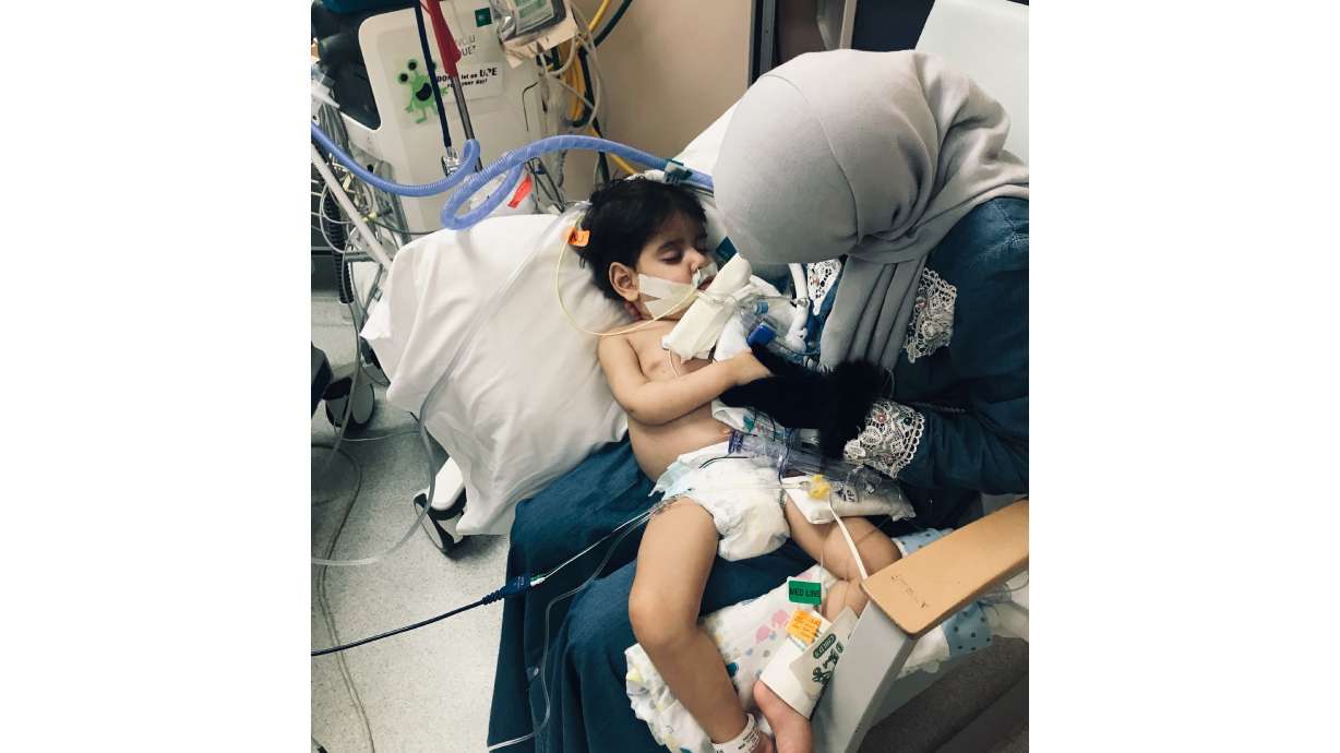 The Latest: Dad says he's angry travel ban kept family apart