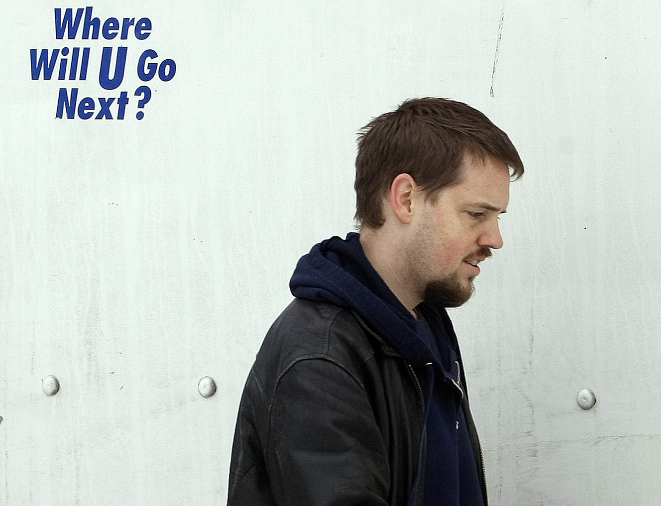 Josh walks past the side of the moving truck and past a small sign on the truck that reads"Where will U Go Next?" as friends and neighbors of Josh Powell assist him in moving back to Washington on Saturday, Jan. 9, 2010. Photo: Scott G Winterton, KSL