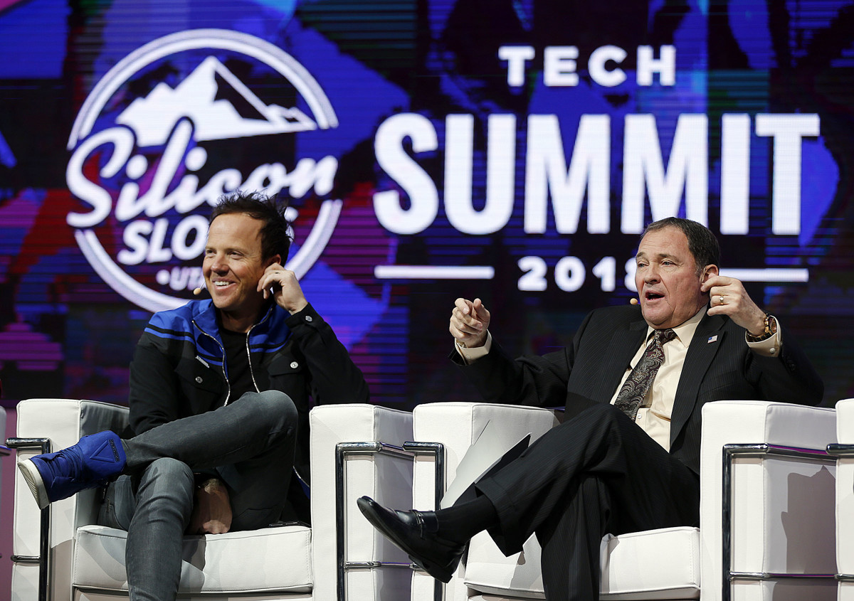 Qualtrics CEO Ryan Smith, left, and Gov. Gary Herbert participate in a panel discussion during the Silicon Slopes Tech Summit in Salt Lake City on Friday, Jan. 19, 2018. (Photo: Ravell Call, KSL)