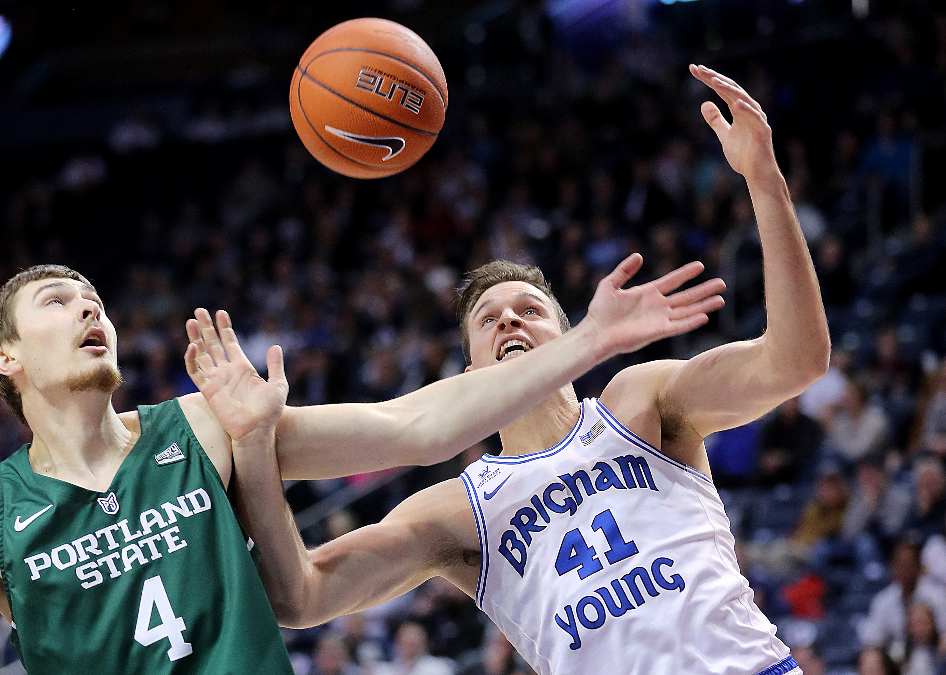 Portland State Vikings forward Brendan Rumel (4) and Brigham Young Cougars forward Luke Worthington (41) battle for the ball as BYU and Portland State play at the Marriott Center in Provo on Wednesday, Dec. 12, 2018. (Photo: Scott G Winterton, KSL)