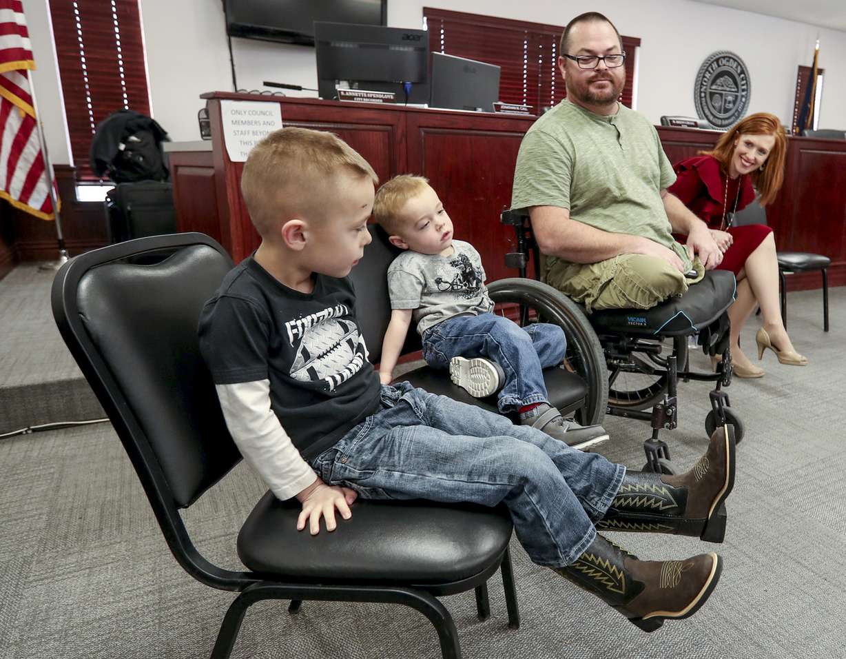 Jennie Taylor, widow of North Ogden Mayor Maj. Brent Taylor, right, talks with Army Sgt. 1st Class Travis Vendela, and two of his children, Kaiden, 3, and Trayden, 4, during a press conference held by the Stephen Siller Tunnel to Towers Foundation at the North Ogden Municipal Building on Thursday, Jan. 3, 2019. The foundation paid off Taylor’s mortgage and is building a new home for Vendela, who lost both legs above the knee in Iraq in 2007. (Photo: Steve Griffin, KSL)