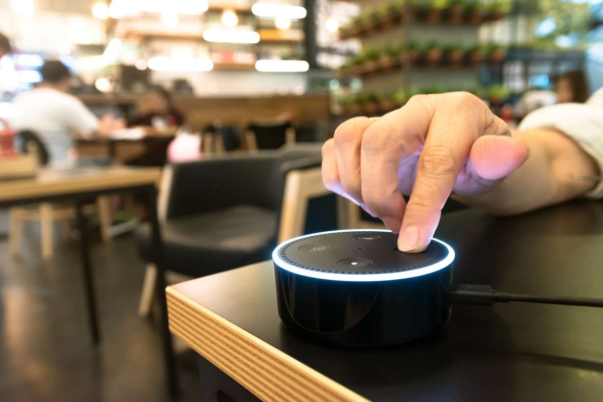 Amazon’s Alexa can sync with a lot of your apps and help you catch up on the news or listen to podcasts and books while you’re busy doing something else like washing dishes or folding laundry. (Photo: Shutterstock)