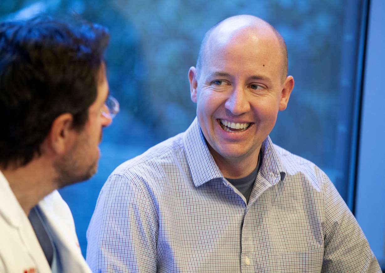Heart transplant recipient Ben Burrup, right, speaks with Dr. Craig Selzman, chief of the Division of Cardiothoracic Surgery at the University of Utah, during a press conference at the University of Utah Hospital in Salt Lake City on Friday, Jan. 4, 2019. Burrup received a new heart in February 2018. University of Utah Health announced Friday it performed a record-breaking number of organ transplants in 2018. (Photo: Laura Seitz, KSL)