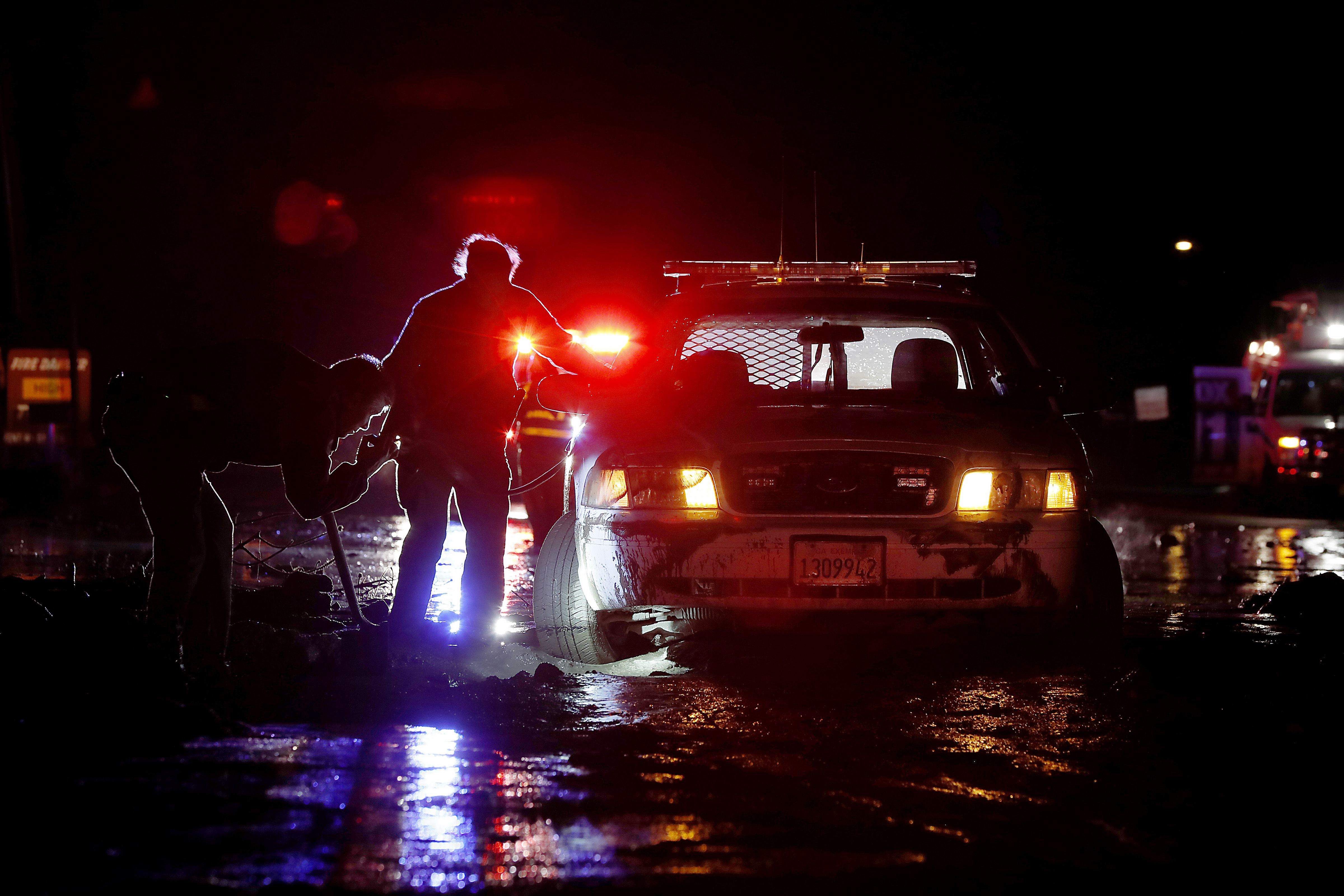 California storm brings power outages, shuts down highway