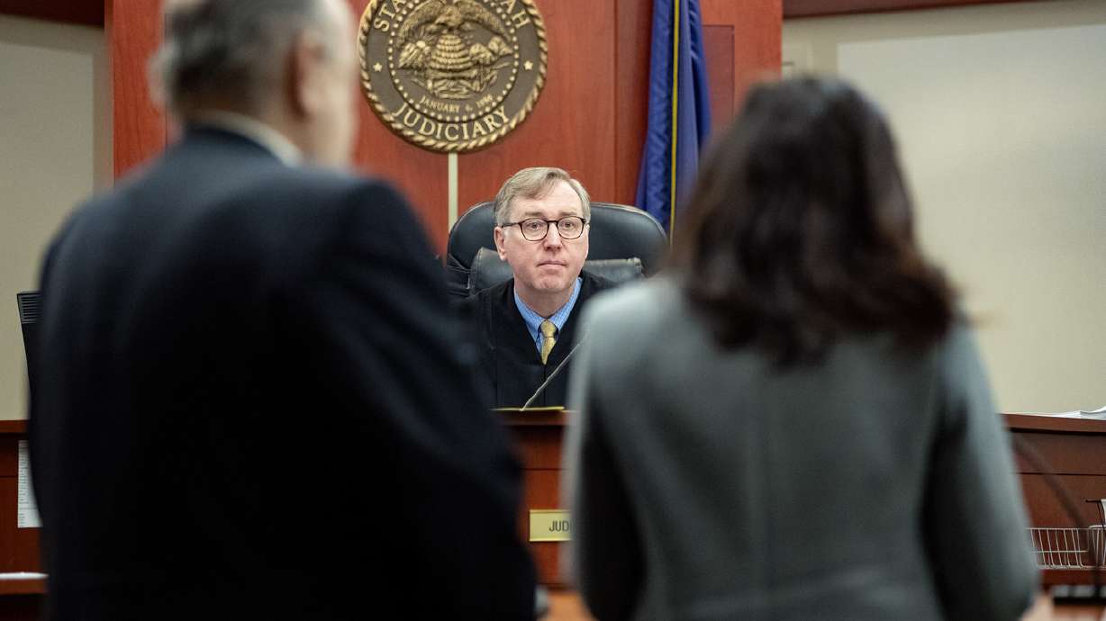Third District Judge Keith Kelly talks to Brent E. Taylor, former director of the Utah Valley Youth Symphony, and his attorney, Cara Tangaro, during a hearing in Salt Lake City on Jan. 7, 2019. Taylor, who is accused of sexually abusing three boys about 30 years ago, is set to go on trial in two cases in October.