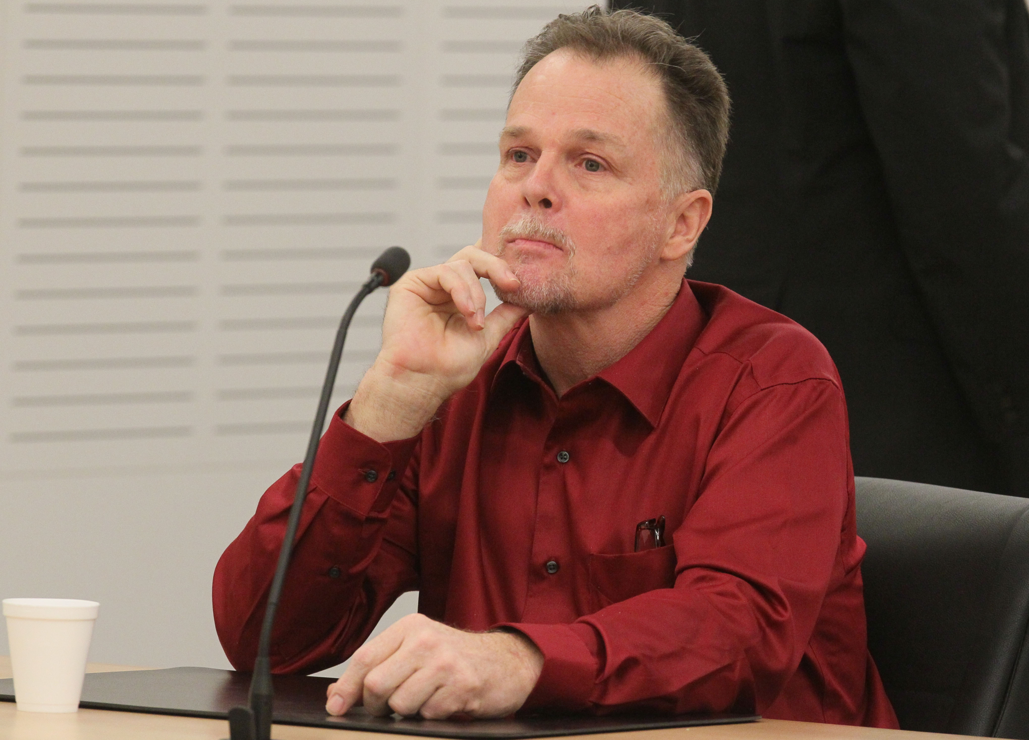 The Latest: ID of family's killer contested in murder trial