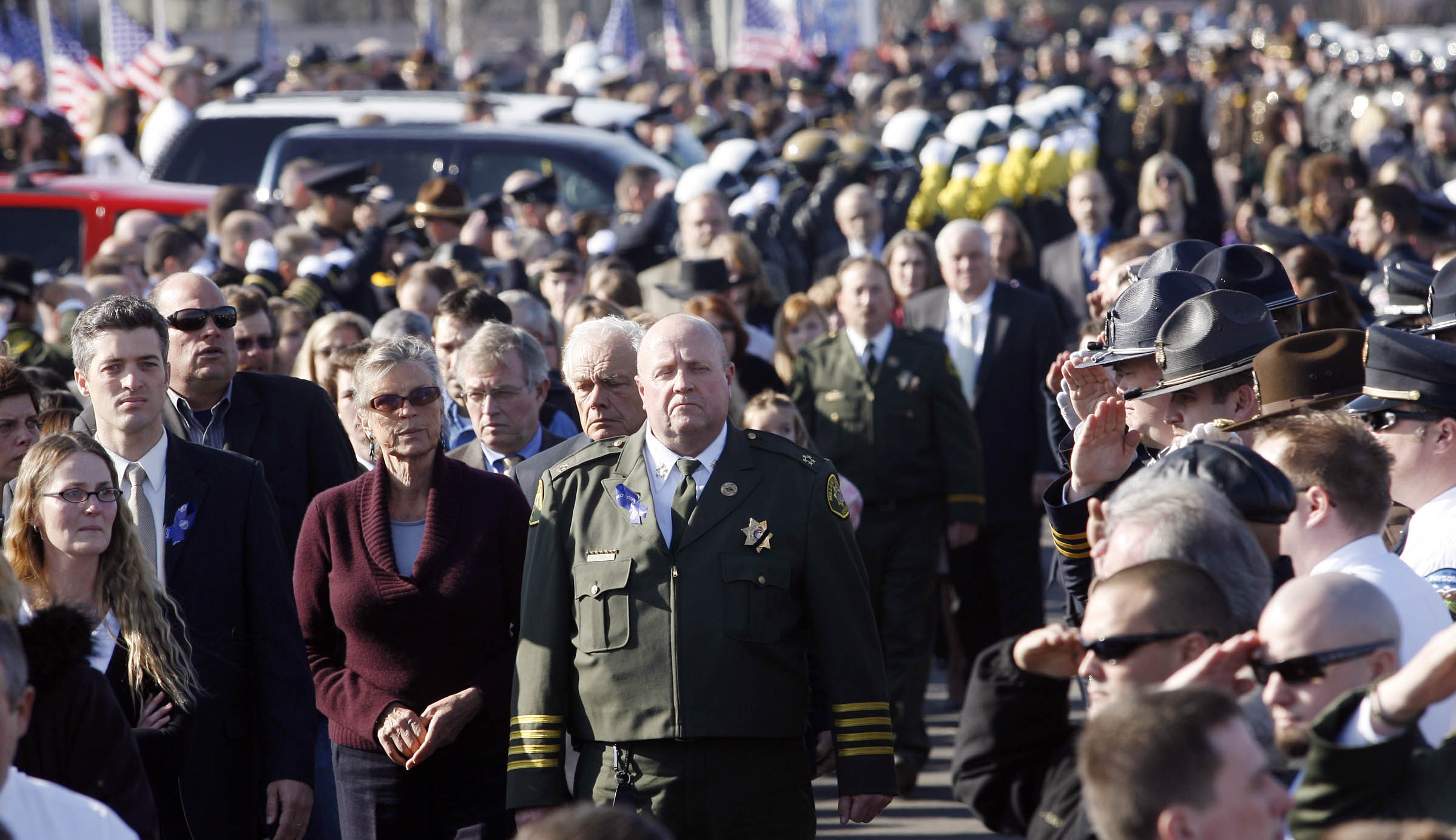 Members of Josie's family and the department follow the casket out of the chapel after services. Hundreds of Police and thousands more from the community gather in Delta Utah for funeral services for Millard County Sheriff's deputy Josie Greathouse Fox. Monday, Jan. 11, 2010. (Photo: Scott G Winterton, Deseret News, File)