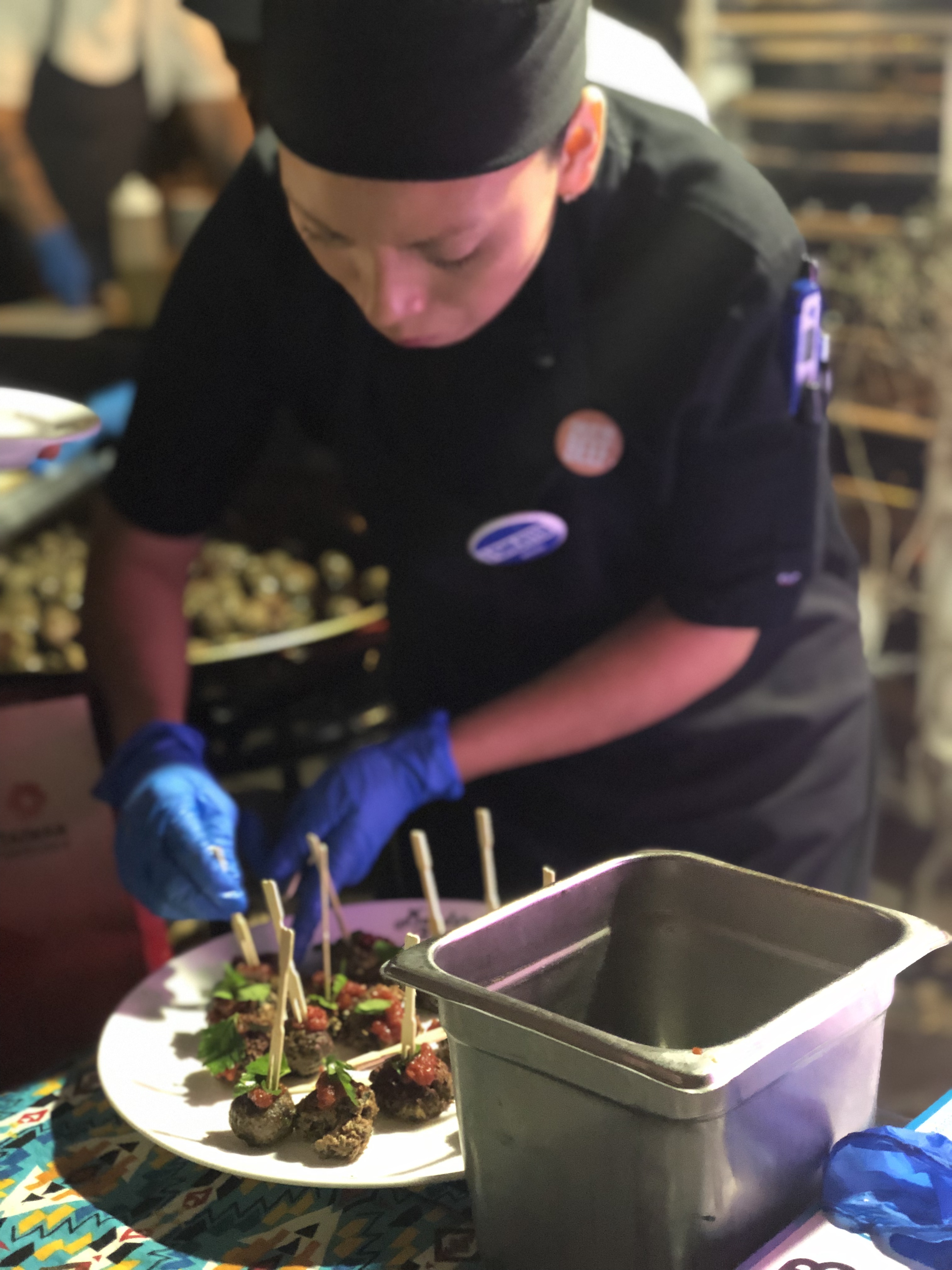 An Impossible Foods server prepares the plant-based meatballs at the company's press conference. (Photo: Liesl Nielsen, KSL.com)