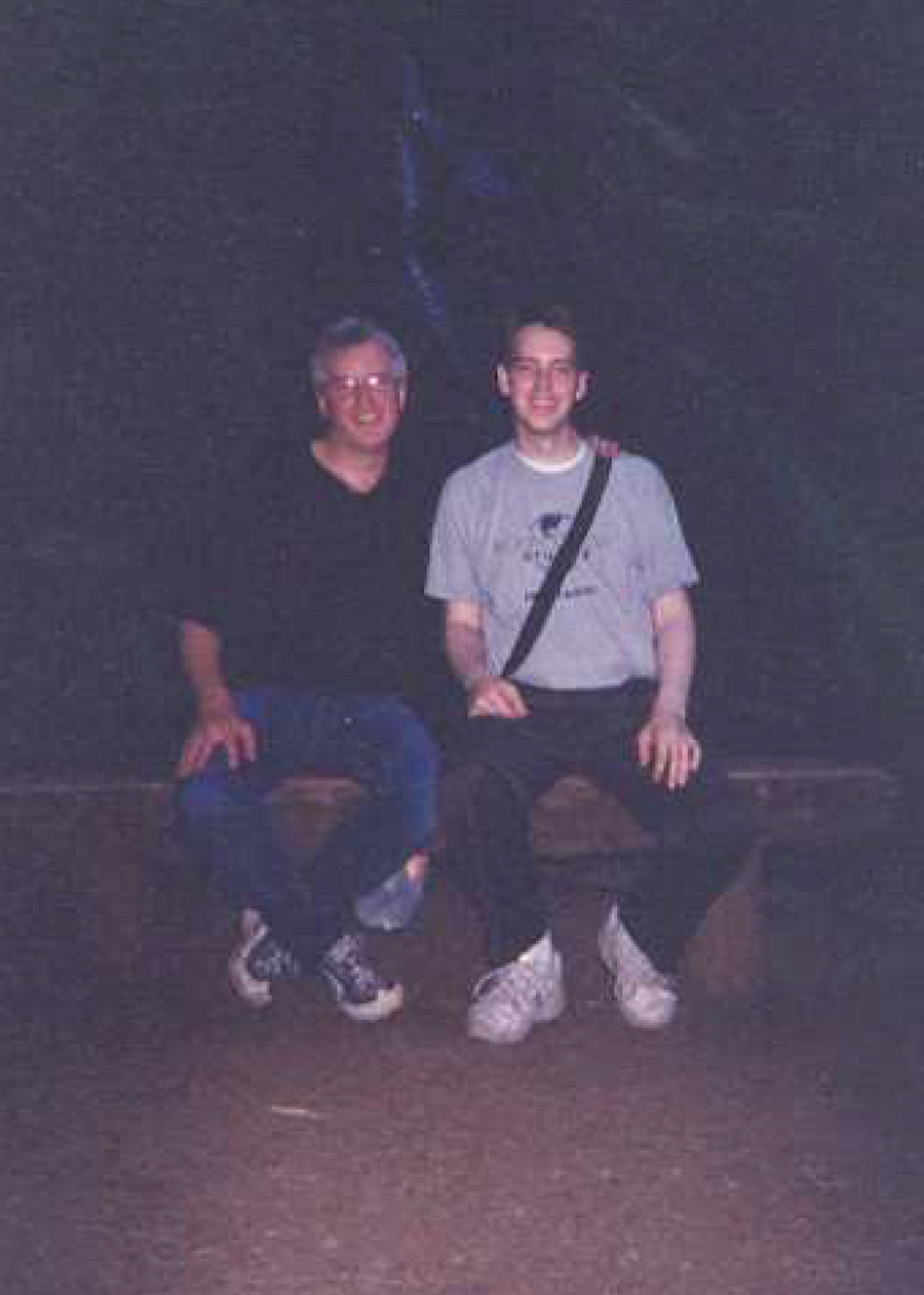 This 2002 photo, presumably taken by Susan Powell, shows Josh and Steve Powell sitting together in front of a waterfall in Silver Falls State Park, Ore. West Valley police seized a print of the photo from Steve Powell's home while serving a search warrant on Aug. 25, 2011. (Photo: Family photo)