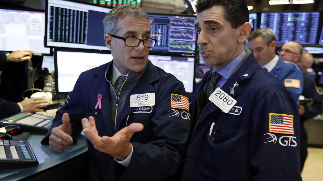 Stocks slip but remain on track for another winning week