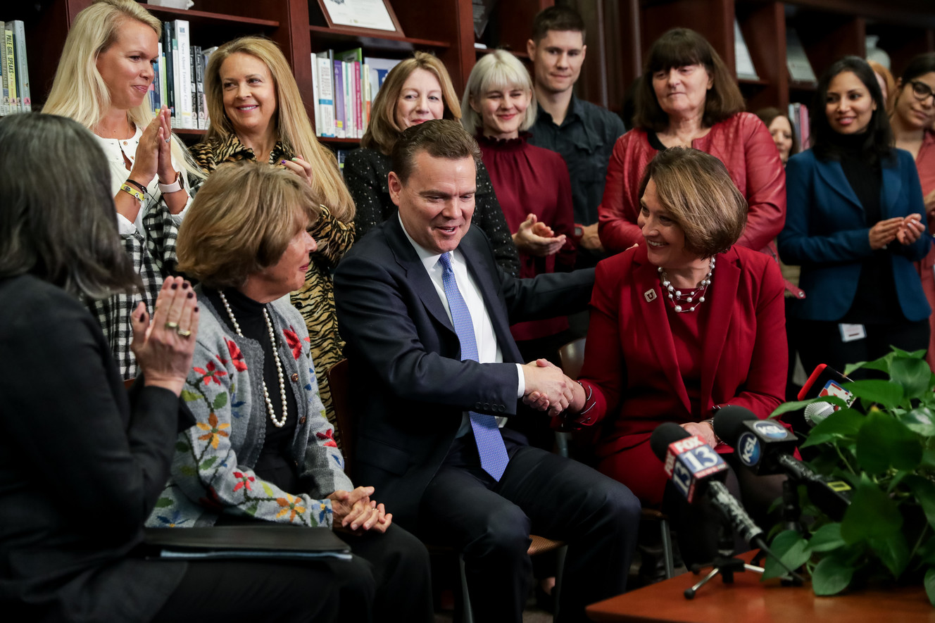 Peter Huntsman, CEO of the Huntsman Foundation and chairman and CEO of the Huntsman Cancer Foundation, shakes hands with Ruth V. Watkins, president of the University of Utah, during a press conference at the Huntsman Cancer Institute in Salt Lake City on Friday, Jan. 11, 2019. (Photo: Spenser Heaps, KSL)