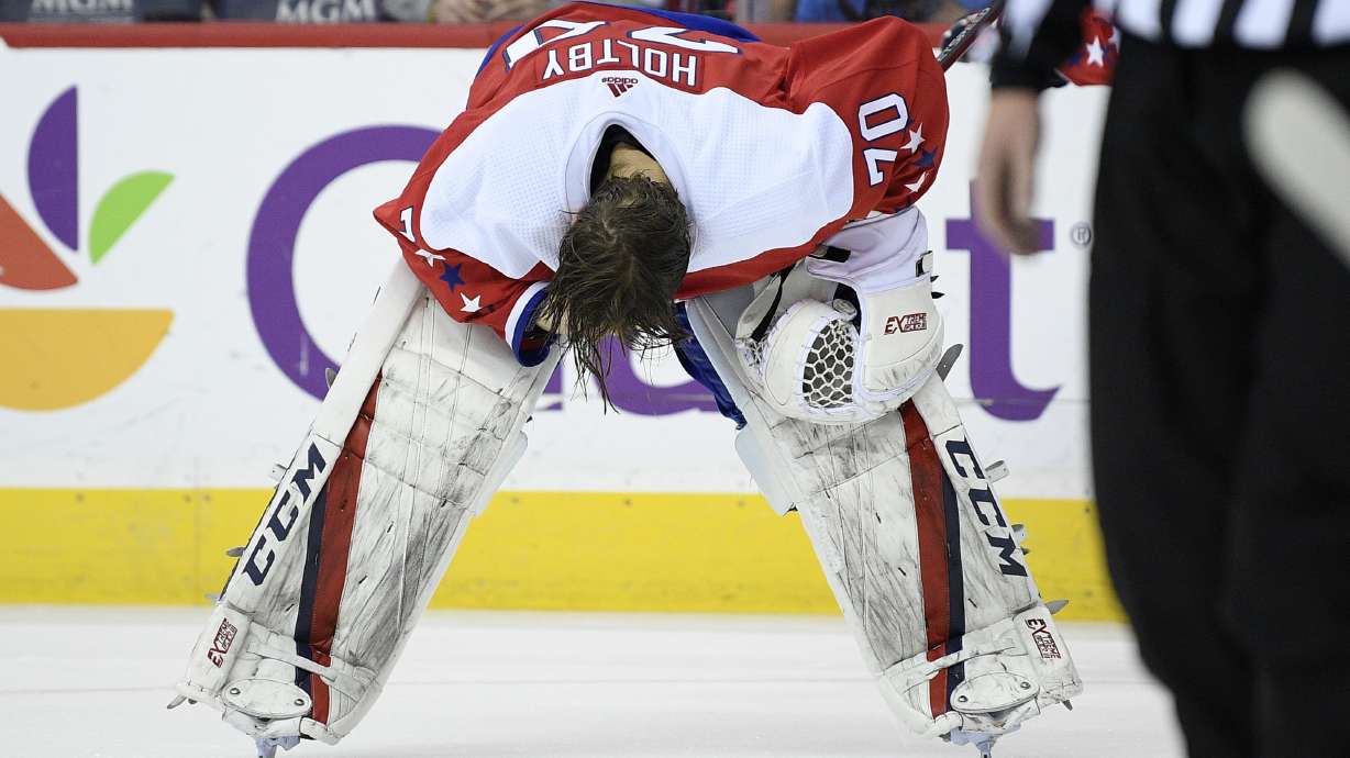 Columbus beats Washington in OT, Holtby suffers eye injury