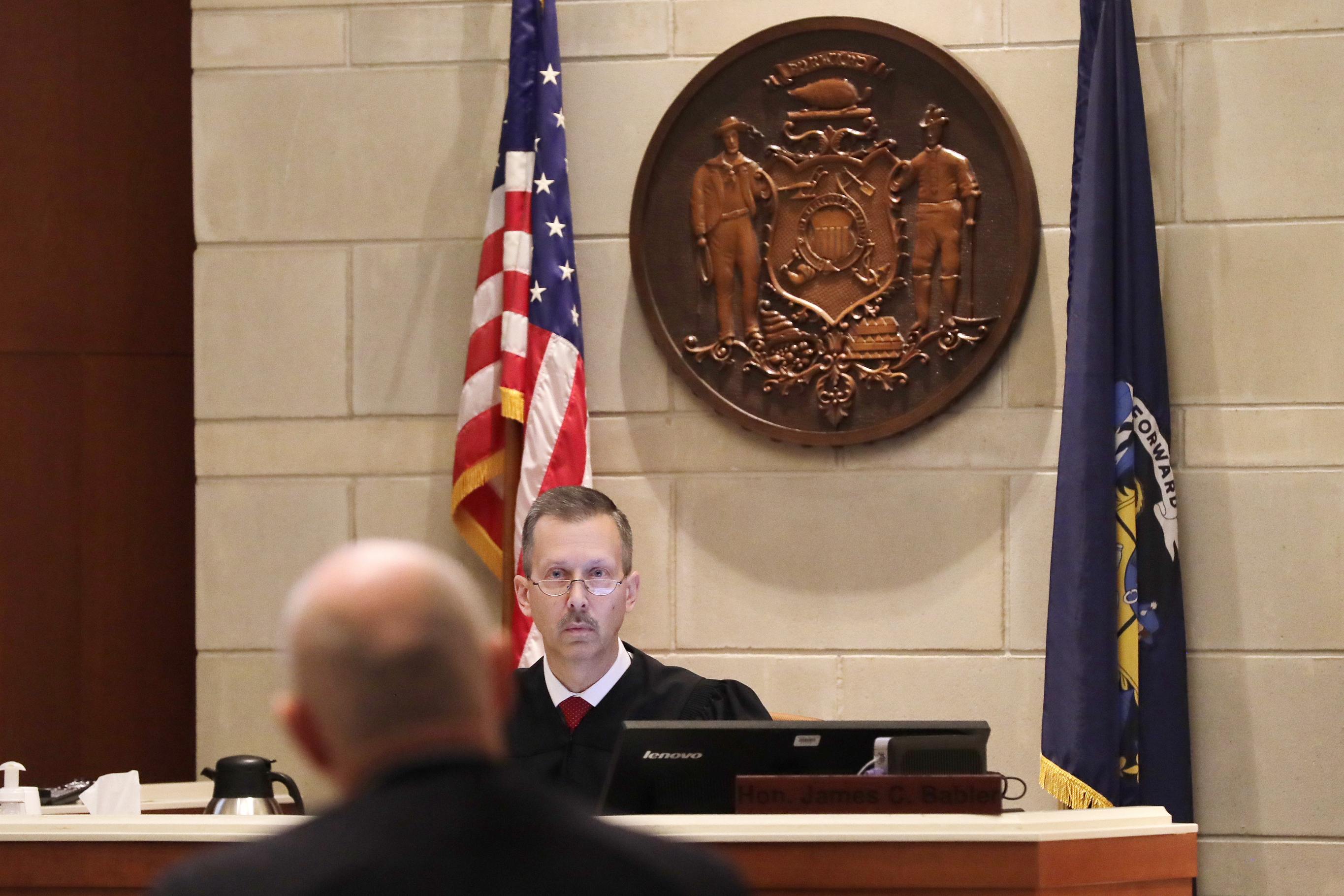 The Latest: Grandfather: Suspect 'backed off from crowds'