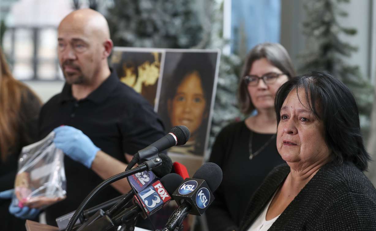 Jason Jensen, a private investigator and co-founder of the Utah Cold Case Coalition, left, listens as Lewine Tapia, right, talks about her daughter, Rosie, who was killed in 1995, during a press conference at the Viridian Event Center in West Jordan on Thursday, Jan. 17, 2019 (Photo: Steve Griffin, KSL)