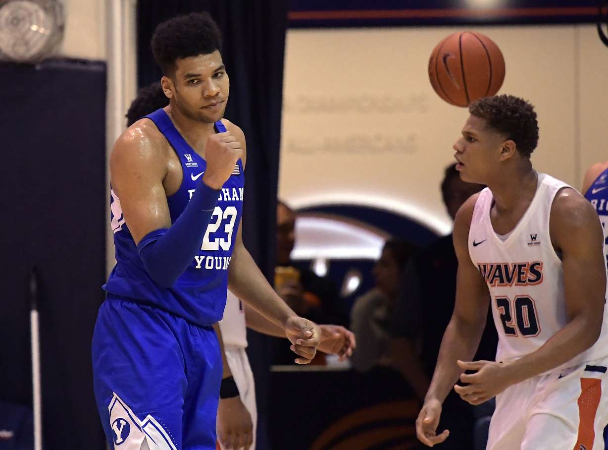 BYU forward Yoeli Childs, left, celebrates after scoring and drawing a foul as Pepperdine forward Kameron Edwards stands nearby during the second half of an NCAA college basketball game Thursday, Jan. 17, 2019, in Malibu, Calif. (Photo: Mark J. Terrill, AP)
