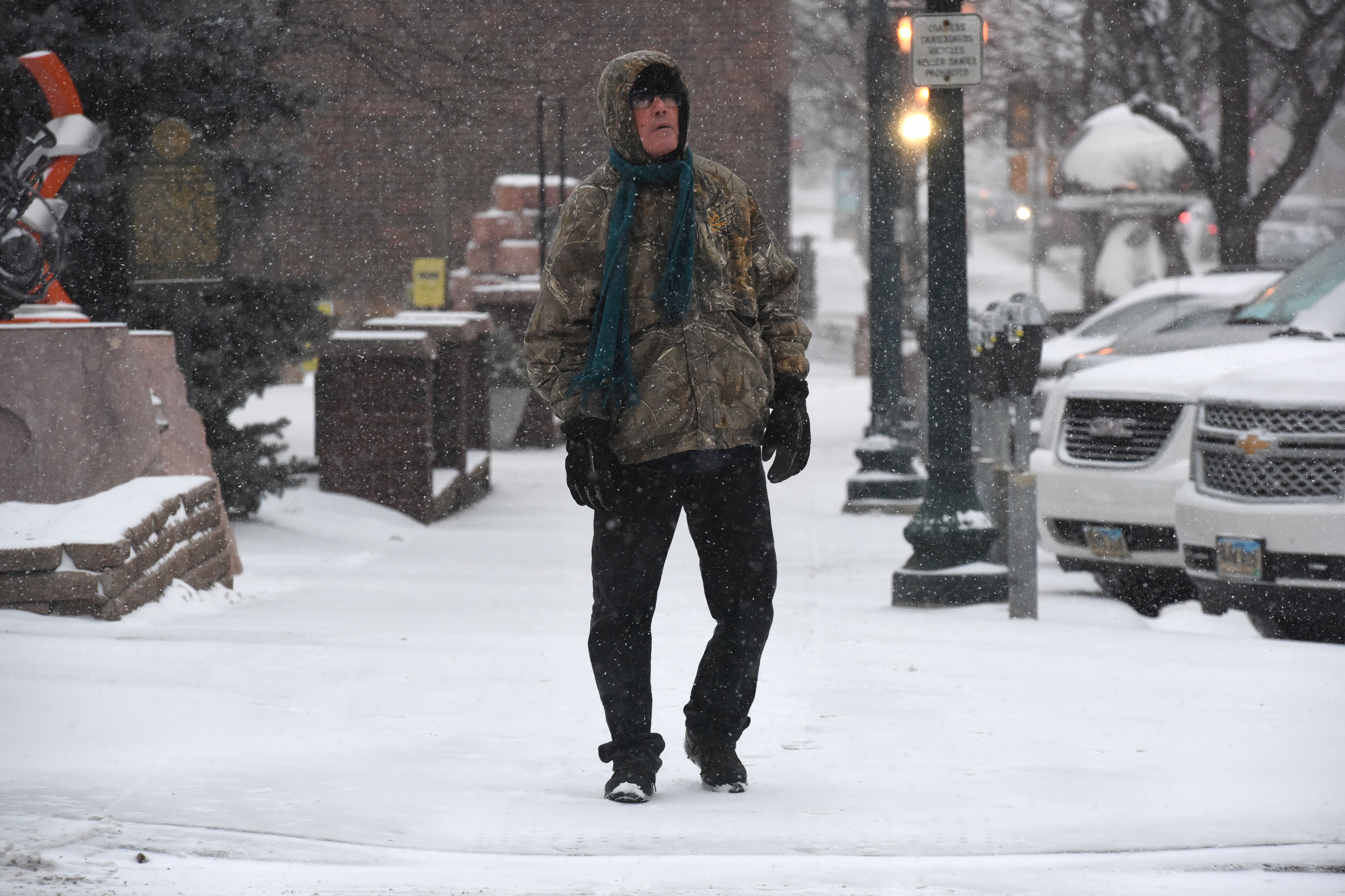 The Latest: Snow falling in parts of the Midwest