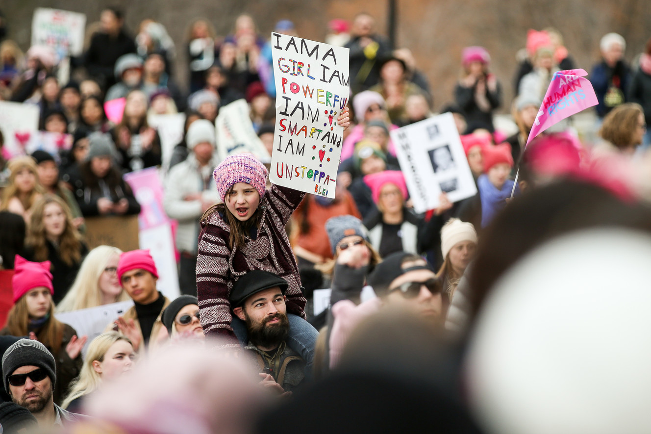 Marion Lindner, 8, sits on the shoulders of her stepfather, Chris Polk, at the Women's March on Utah at the Capitol in Salt Lake City on Saturday, Jan. 19, 2019. (Photo: Spenser Heaps, KSL)