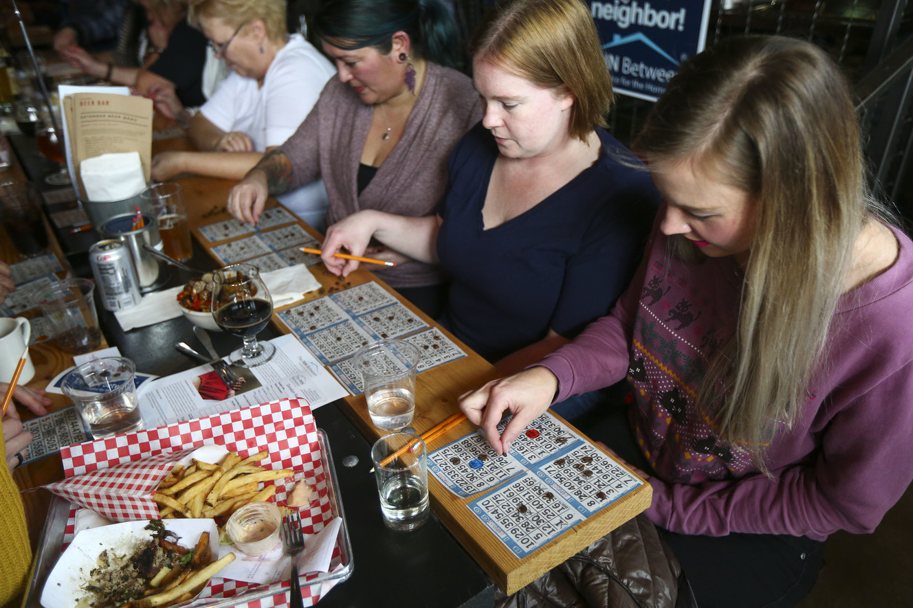 Patrons play charity bingo during a fundraiser by YIMBY Group members to raise money for the Inn Between, which provides hospice care for people experiencing homelessness, at the Beer Bar in Salt Lake City on Sunday, Jan. 20, 2019. (Photo: Silas Walker, KSL)