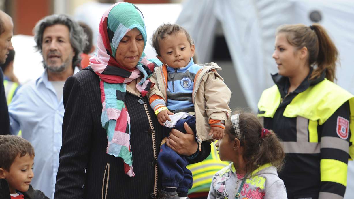 The Latest: Italy deputy PM downplays France migrant remarks