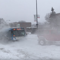 Have You Seen This? 3 vehicles pull bus full of passengers up snowy hill