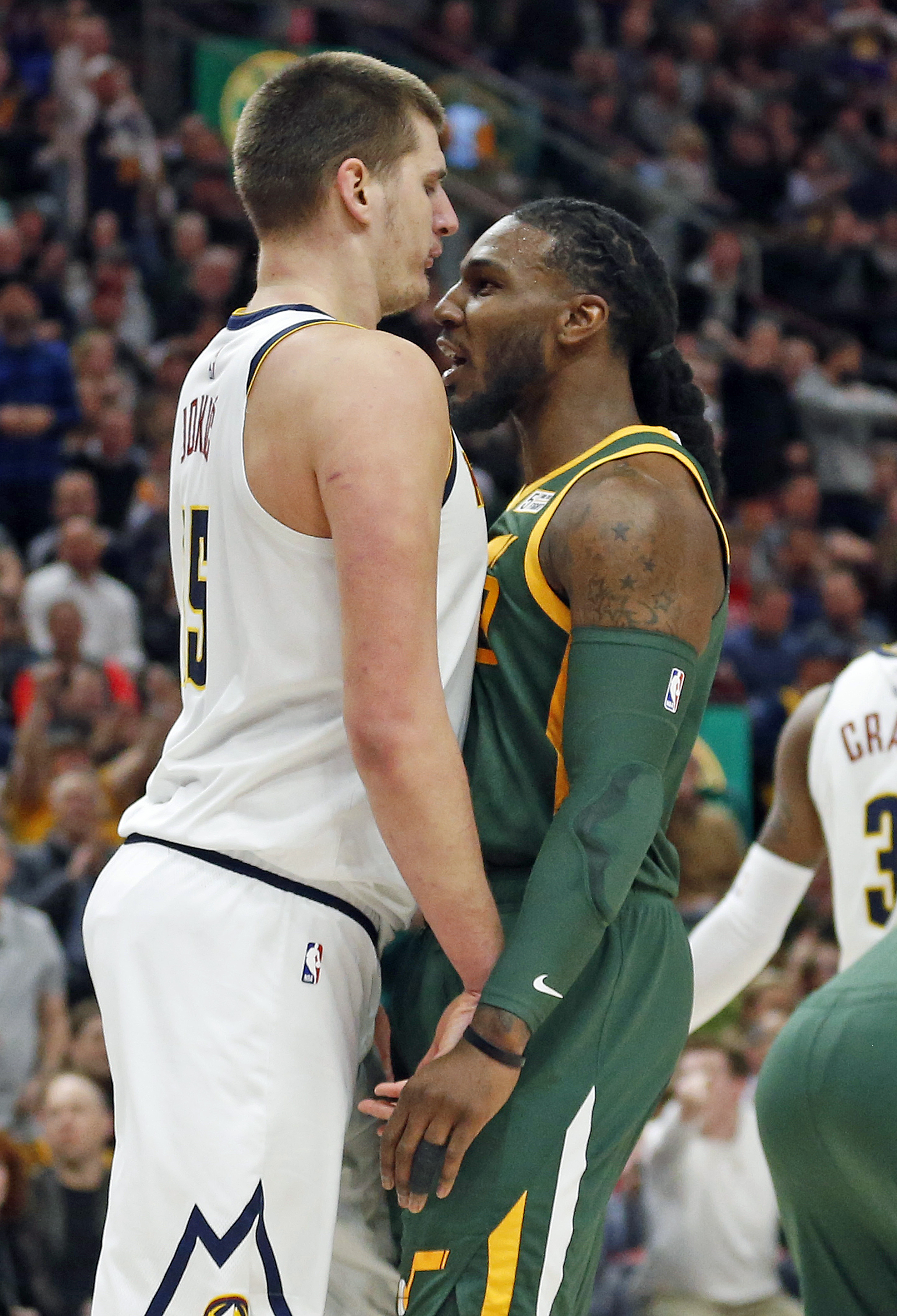 Denver Nuggets center Nikola Jokic, left, and Utah Jazz forward Jae Crowder face off during the first half of an NBA basketball game, Wednesday, Jan. 23, 2019, in Salt Lake City. (AP Photo/Rick Bowmer)