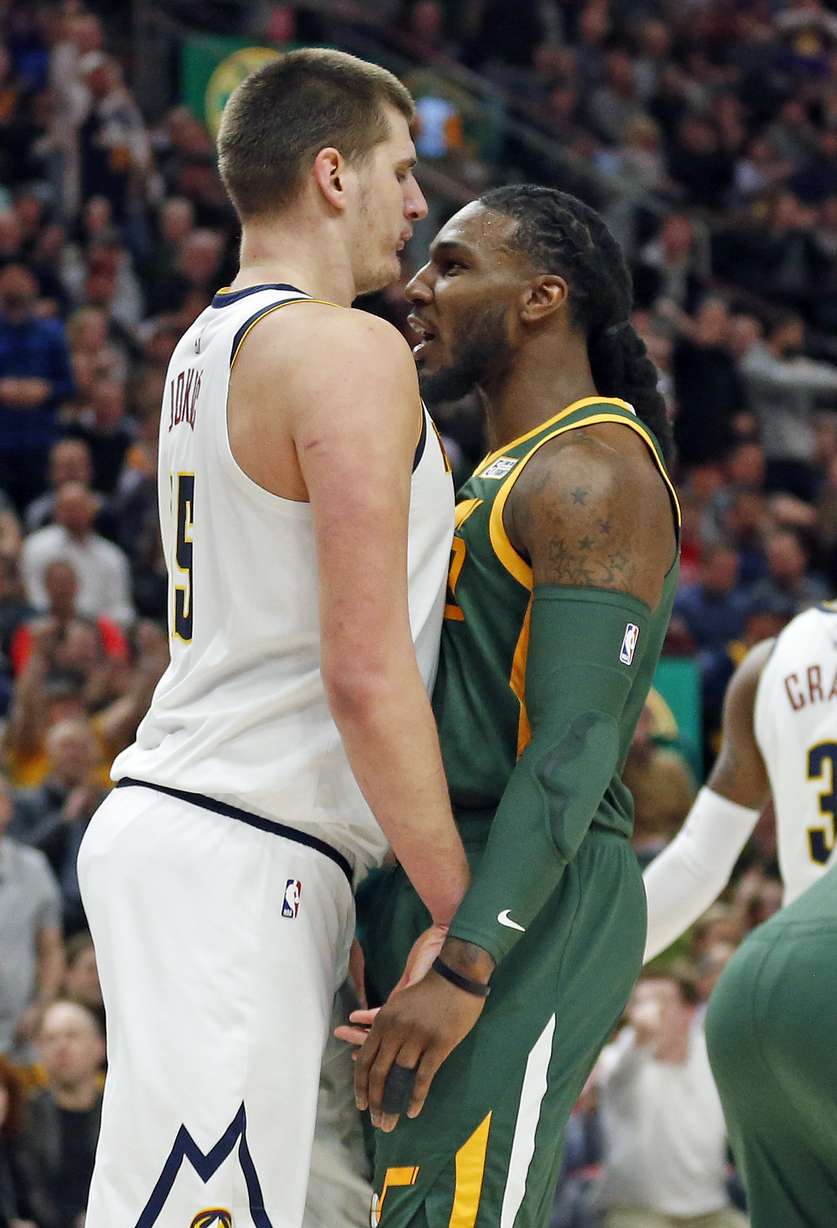 Denver Nuggets center Nikola Jokic, left, and Utah Jazz forward Jae Crowder face off during the first half of an NBA basketball game, Wednesday, Jan. 23, 2019, in Salt Lake City. (AP Photo/Rick Bowmer)