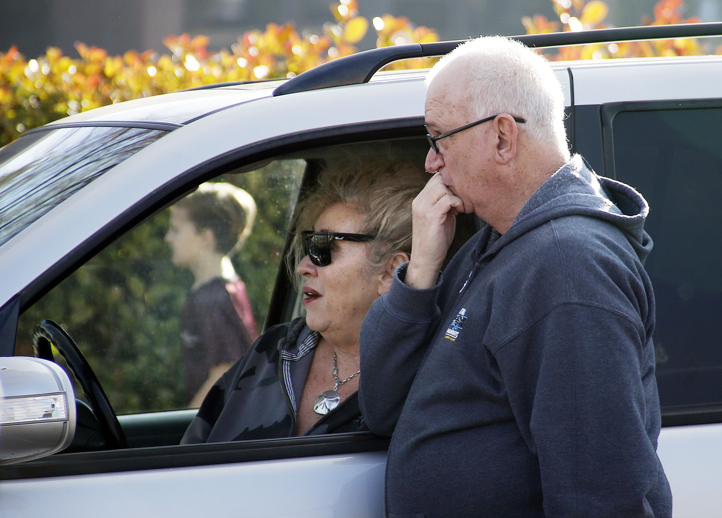 John Gordon and Michelle Tooke watch as firefighters work on a fire at the St. George East Stake Center of the Church of Jesus Christ of Latter-day Saints on Saturday, Jan. 26, 2019. (Photo: Ravell Call, KSL)