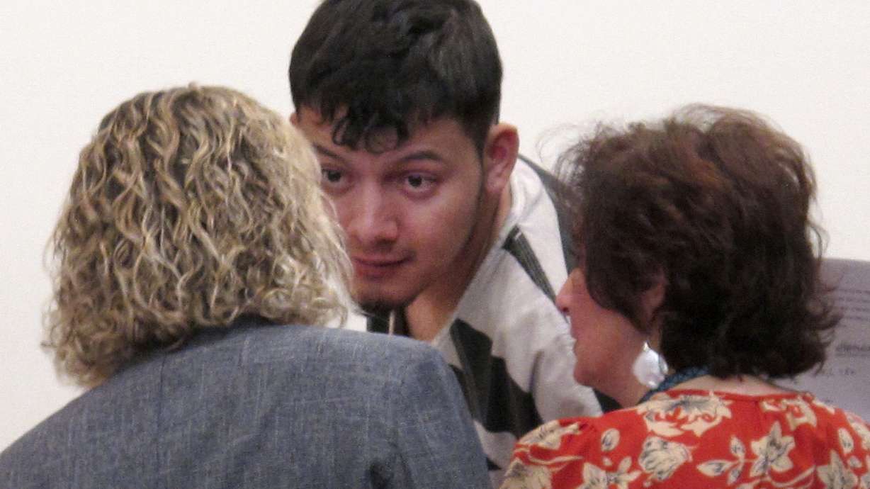 The Latest: Man accused in 4 murders worked for slain couple