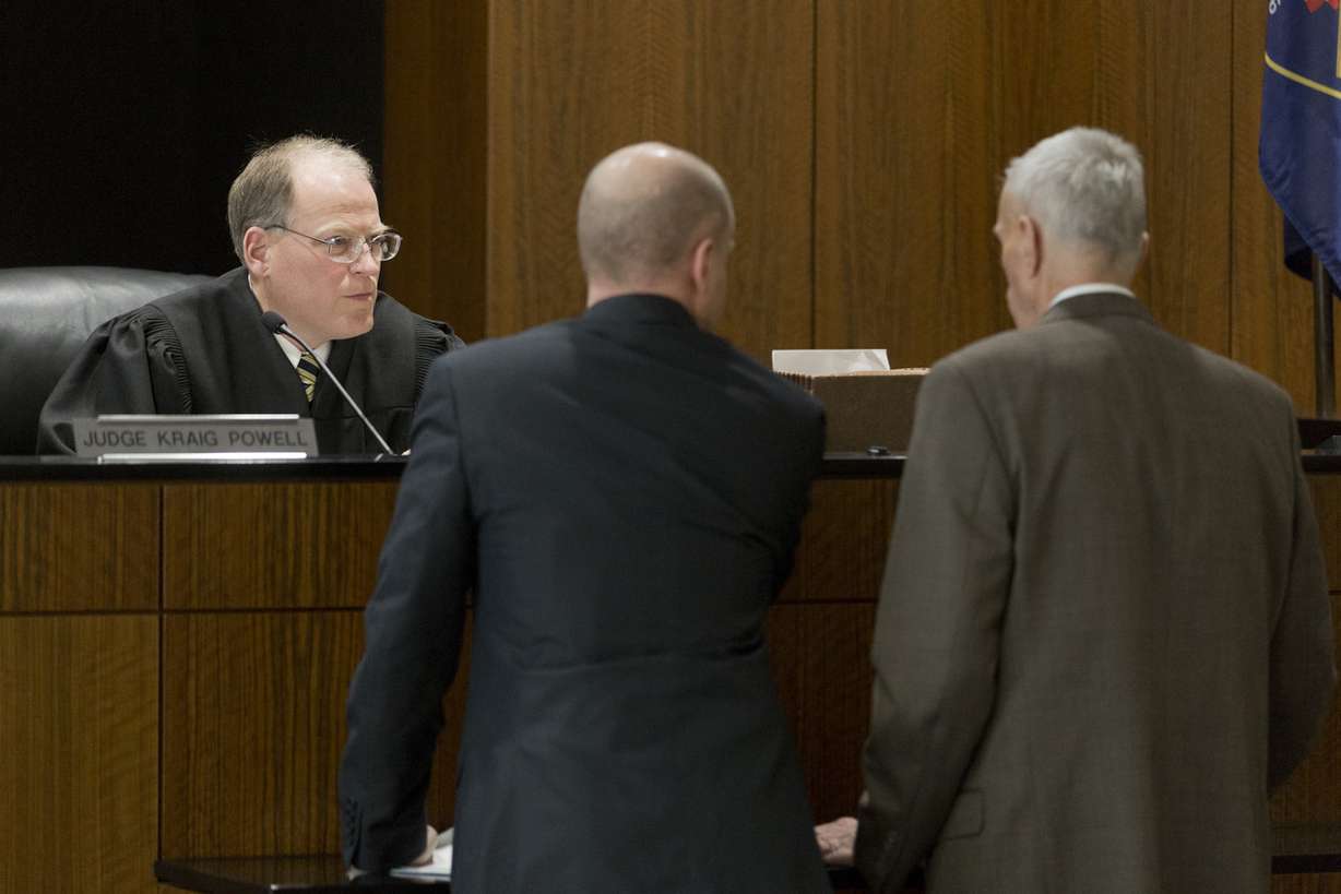 Judge Kraig Powell, left, speaks with attorneys Chad Grunander, center, and Tom Means, right, during Matt Frank Hoover's initial appearance on Jan. 28, 2019, in Provo. Powell agreed to delay Hoover's trial on Wednesday.