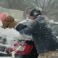 Have You Seen This? Dad uses son to get snow off car