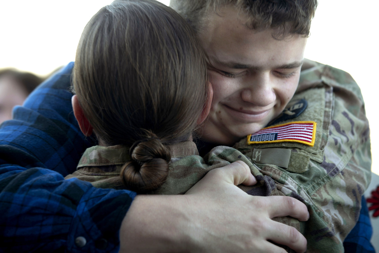Bradley Winters hugs his sister, Utah Army National Guard Sgt. Jullienne Labrum at the Utah Air National Guard’s Roland R. Wright Air Base in Salt Lake City on Thursday, Jan. 31, 2019, after the 65th Field Artillery Brigade returned from a more than 10-month deployment in the Middle East. (Photo: Laura Seitz, KSL)
