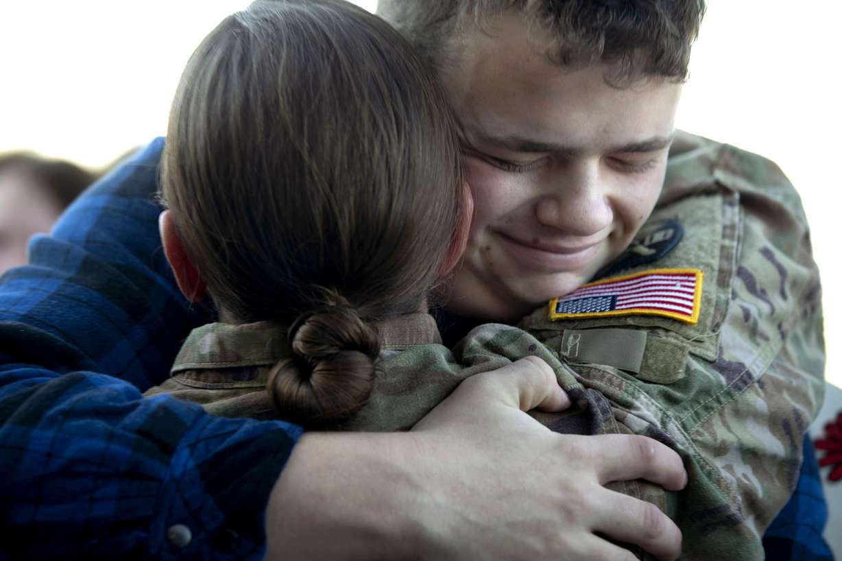 Bradley Winters hugs his sister, Utah Army National Guard Sgt. Jullienne Labrum at the Utah Air National Guard’s Roland R. Wright Air Base in Salt Lake City on Thursday, Jan. 31, 2019, after the 65th Field Artillery Brigade returned from a more than 10-month deployment in the Middle East. (Photo: Laura Seitz, KSL)