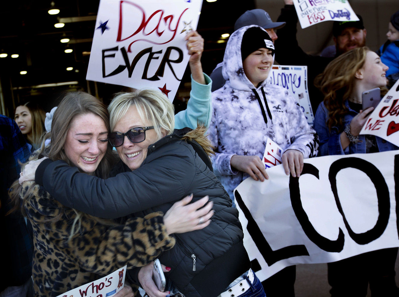 Tiffani Prince and her mother, Danelle Raymond, embrace as an airplane carrying soldiers with the Utah Army National Guard’s 65th Field Artillery Brigade lands at the Utah Air National Guard’s Roland R. Wright Air Base in Salt Lake City on Thursday, Jan. 31, 2019. (Photo: Laura Seitz, KSL)